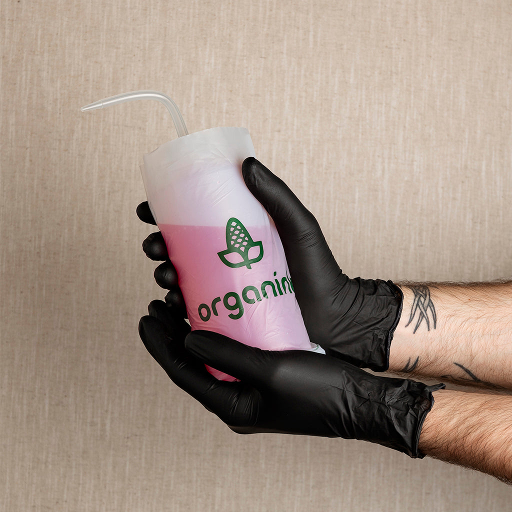Grossiste matériel tatouage organink distributeur français protection écoresponsable bouteille amidons maïs pissette blanc orange grip